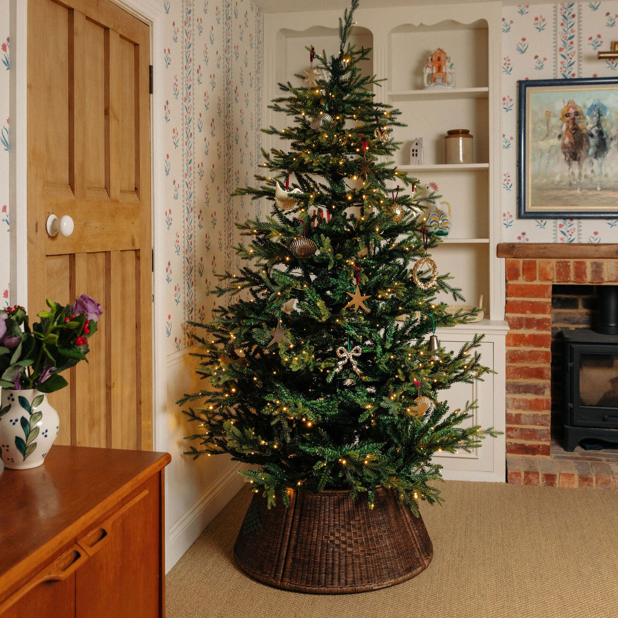 Adeline-rattan-tree-skirt-with-a-christmas-tree
