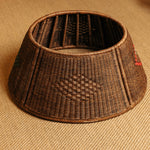 Woven brown tree skirt on a beige fabric background