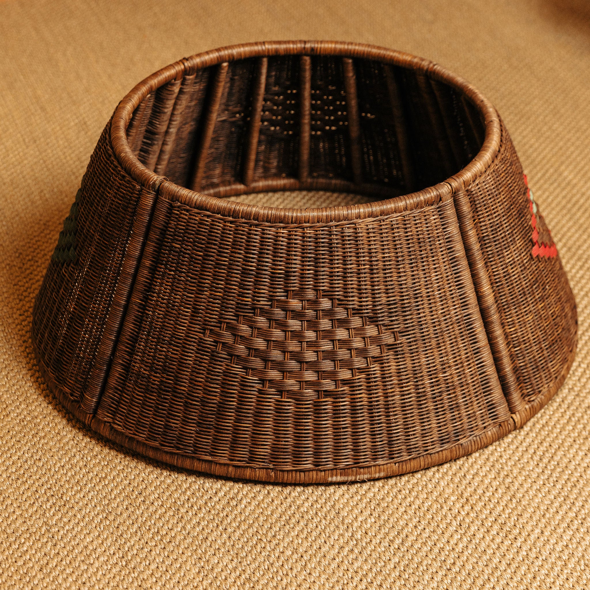 Woven brown tree skirt on a beige fabric background