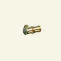Gold cylindrical object on a beige background