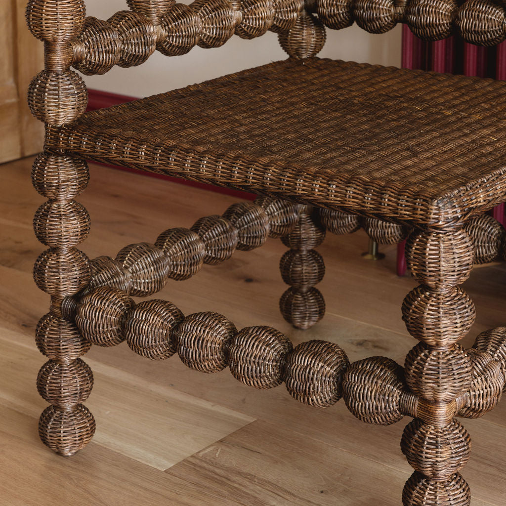Bobbin-rattan-corner-chair-close-up-legs