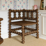 Bobbin-rattan-corner-chair-in-a-corner