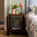 Bobbin-side-table-as-a-bedside-table-with-a-bed