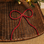 Bow-rattan-christmas-tree-skirt-close-up-red
