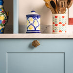 Curved-shell-knob-aged-brass-lifestyle