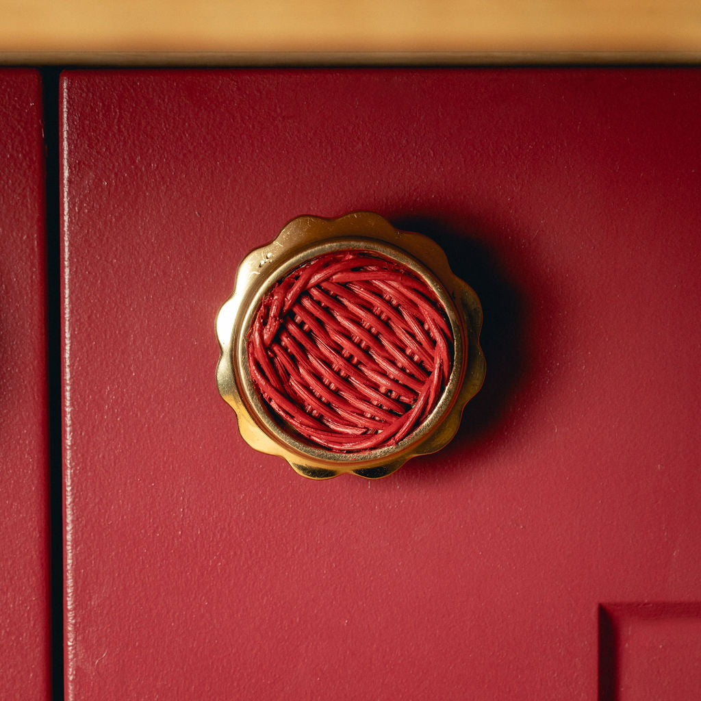Delilah Round Knob Red, Lacquered Brass red background