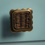 Delilah Square Knob Teak, Aged Brass red background