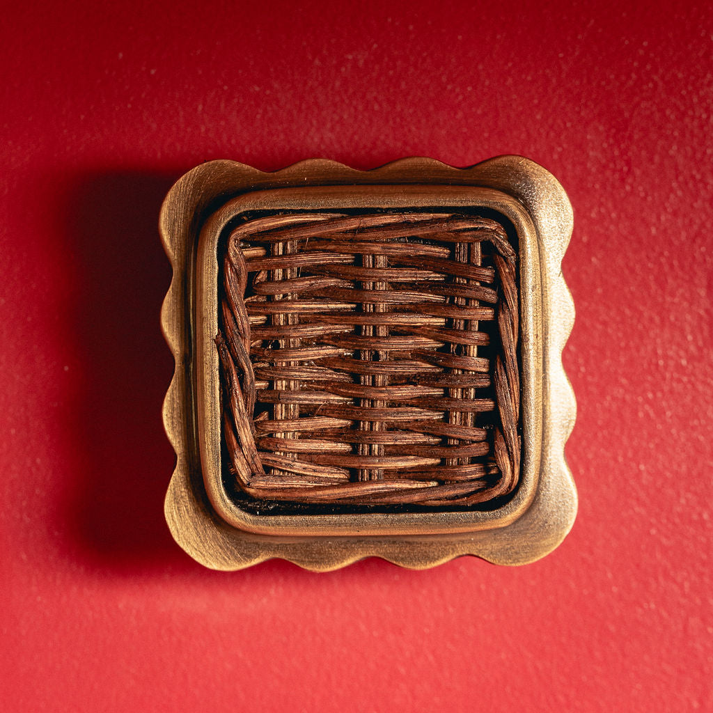 Delilah Square Knob Teak, Aged Brass red background