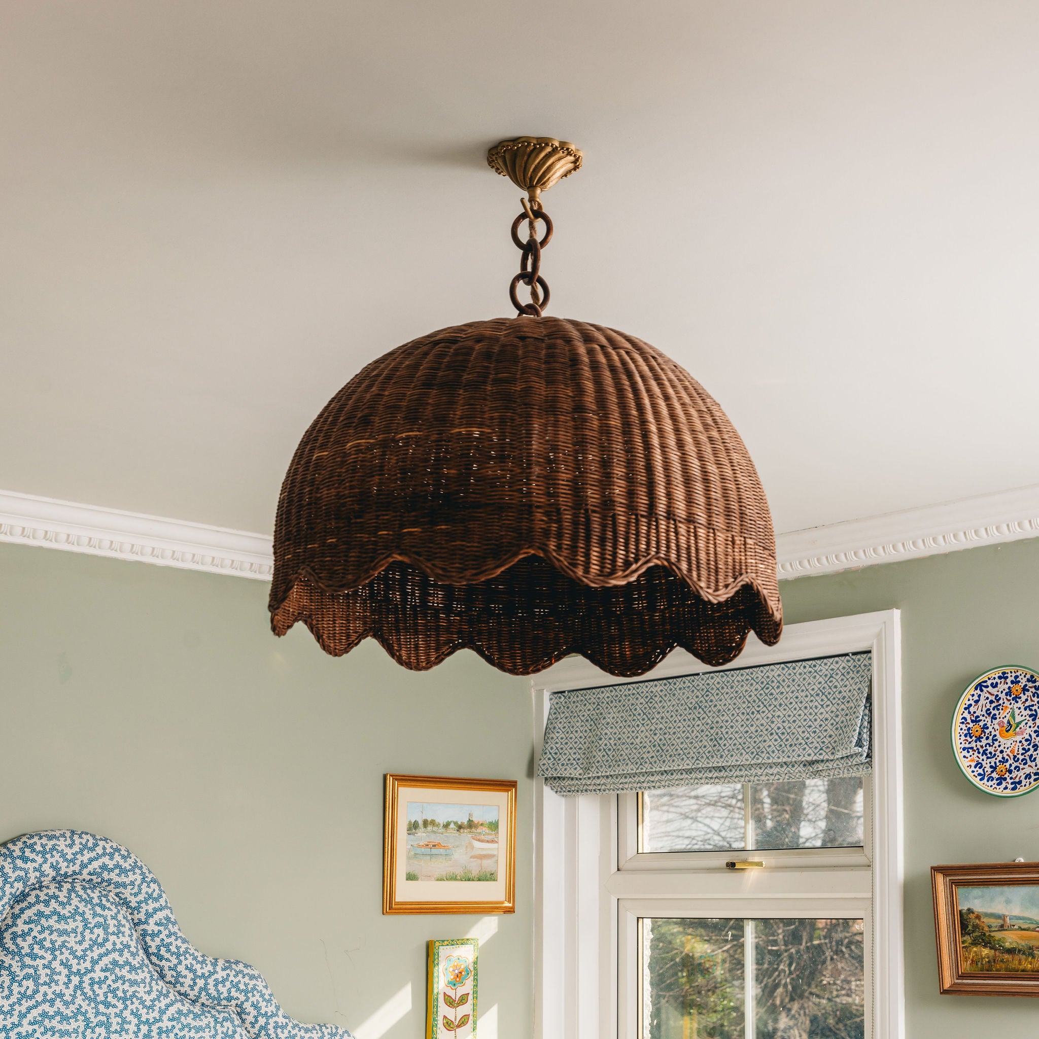 Etta-rattan-pendant-shade-with-chain-teak-large-in-a-bedroom