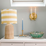 Shell-brass-cabdle-holder-dual-with-candles-burning