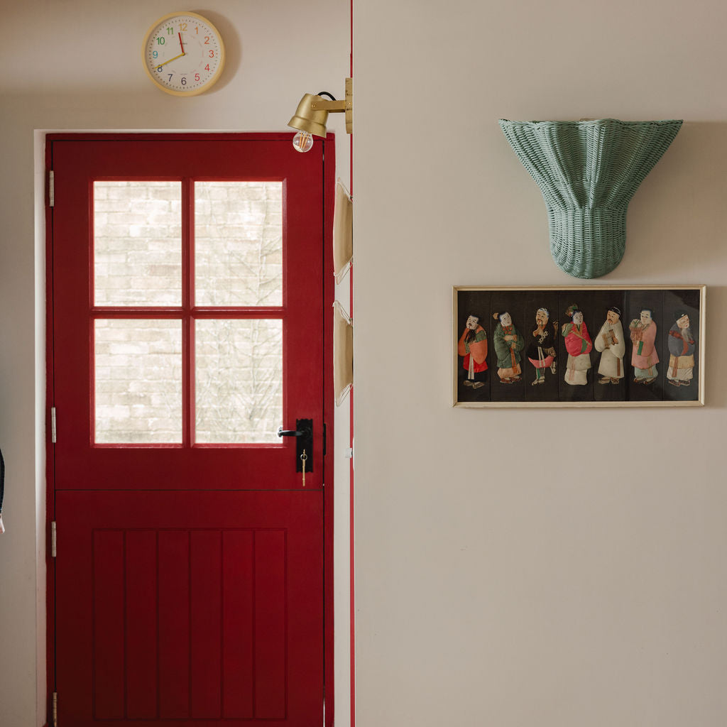 Luna-wall-light-large-light-blue-on-a-wall-with-painting