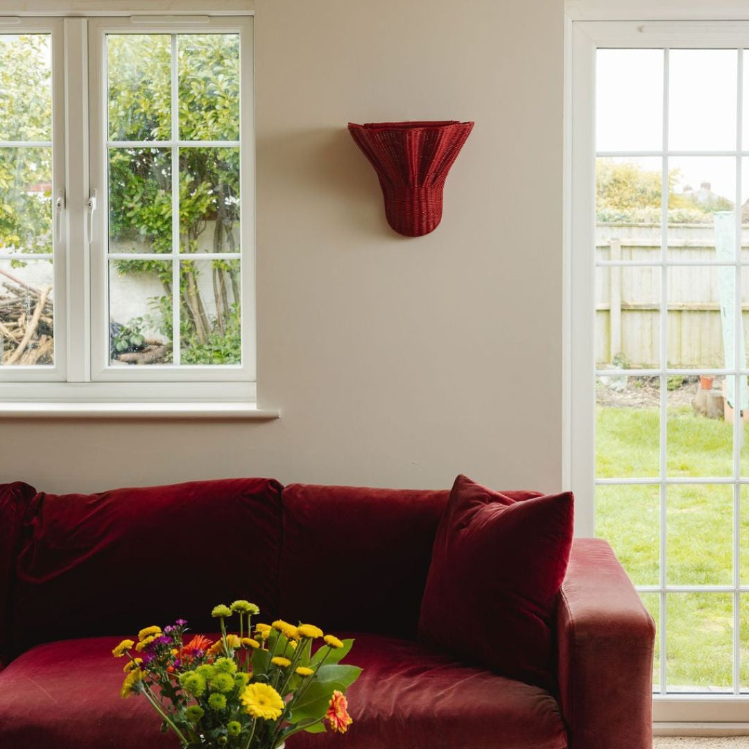 Luna-wall-light-large-red-on-a-wall-with-painting