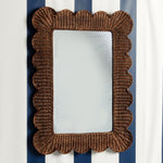 Mimi-scalloped-mirror-large-teak-on-a-wall