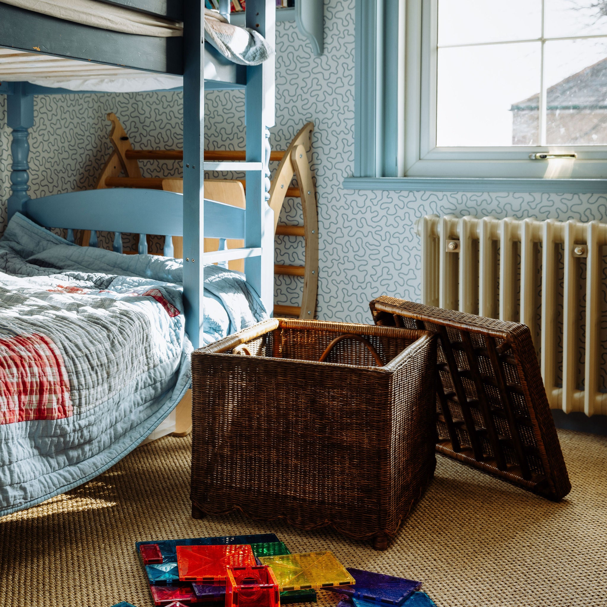 NINA-SCALLOPED-OTTOMAN-TEAK-IN-PLAYROOM