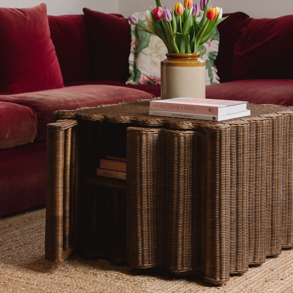 Peony-rattan-coffee-table-with-a-sofa-open-door-close-up-side-angle