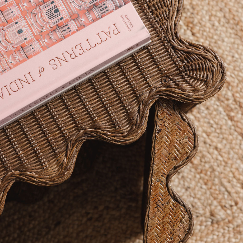 Peony-rattan-coffee-table-with-a-sofa-open-door-close-up