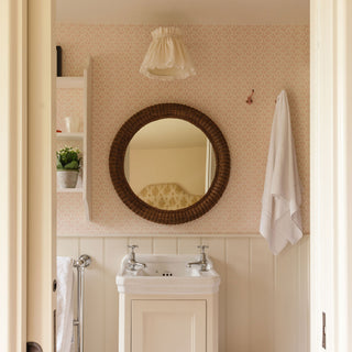 Polly-rattan-round-mirror-on-the-wall