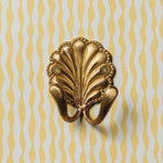 SHELL-BRASS-WALL-HOOK-DOUBLE-ON-A-WALL