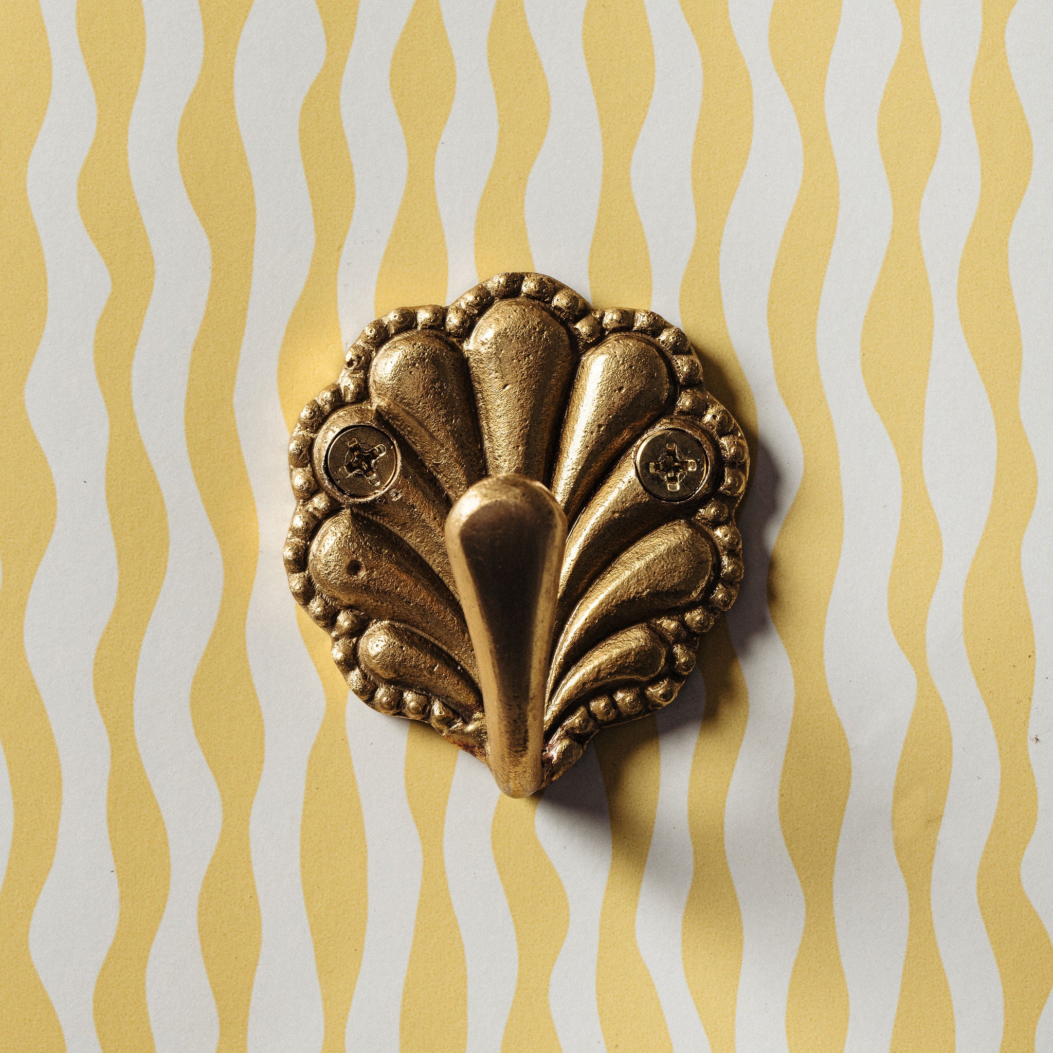 SHELL-BRASS-WALL-HOOK-SINGLE-ON-A-WALL