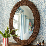 Serena-oval-mirror-teak-large-on-a-chest-of-drawer-front-image
