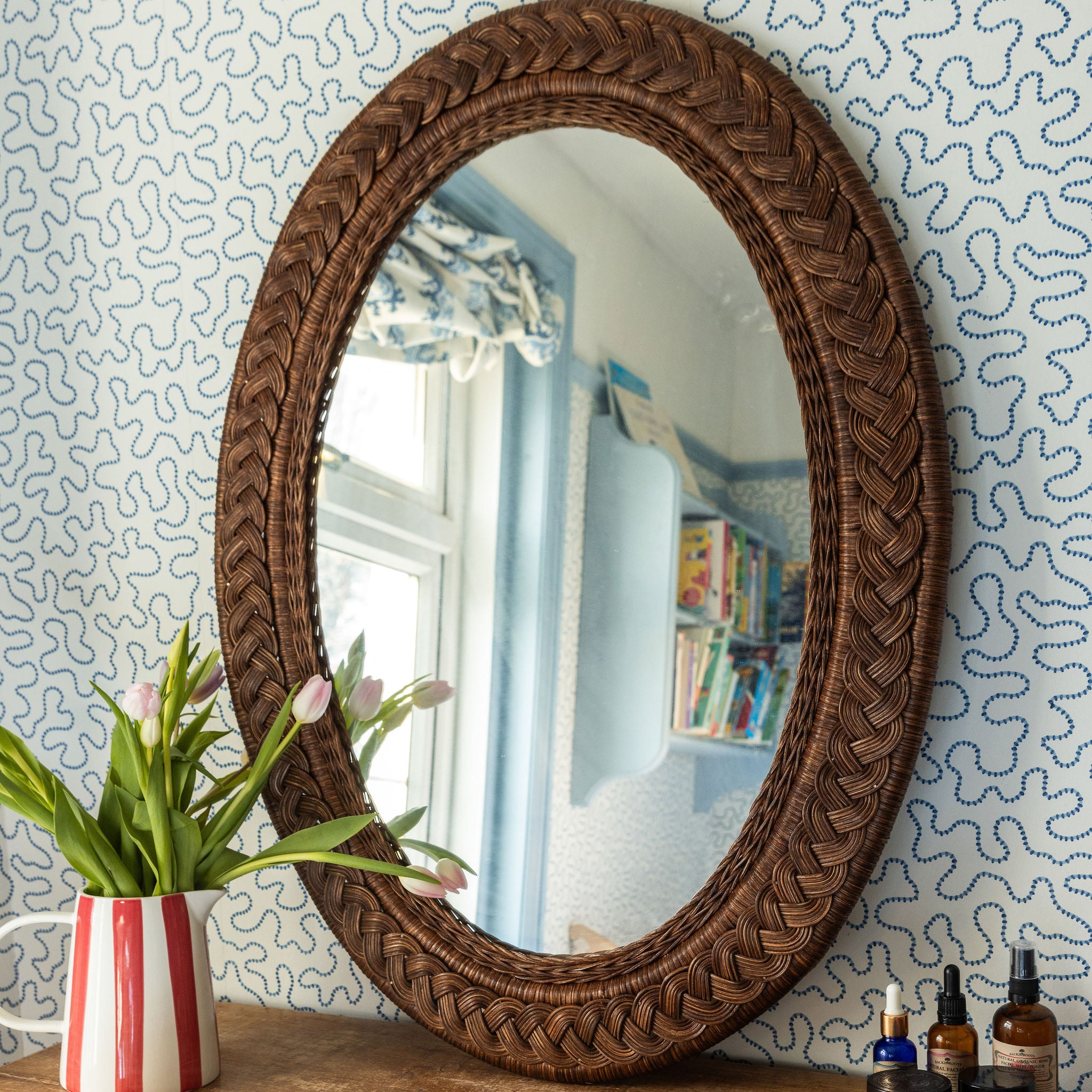 Serena-oval-mirror-teak-large-on-a-chest-of-drawer-front-image
