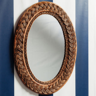 Serena-oval-mirror-teak-on-a-wall