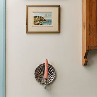 Shell-wall-sconce-single-chrome-front-with-a-candle
