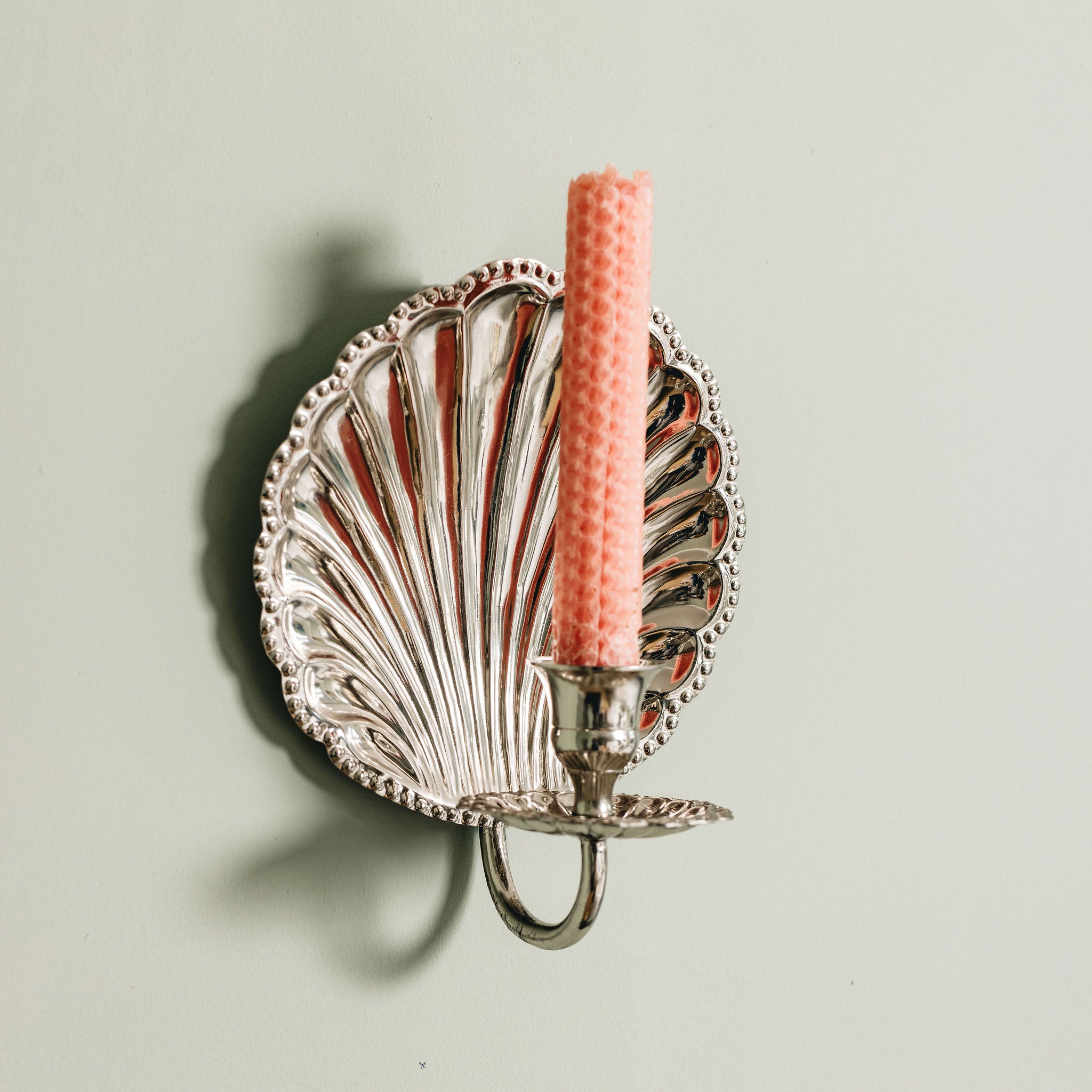 Shell-wall-sconce-single-chrome-with-a-candle-side