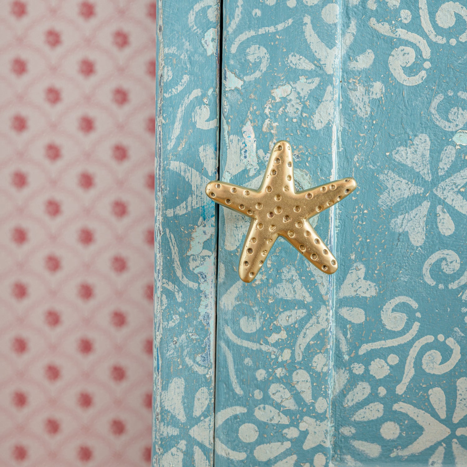 Decorative box with starfish design on a blue patterned background