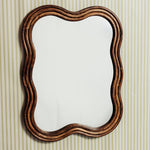 Wave-rattan-mirror-medium-on-a-wall